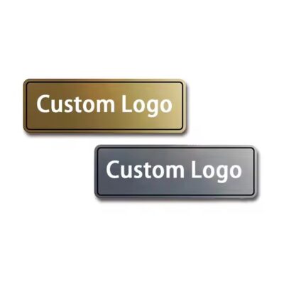 Close-up of a custom 3D engraved metal tag with detailed branding