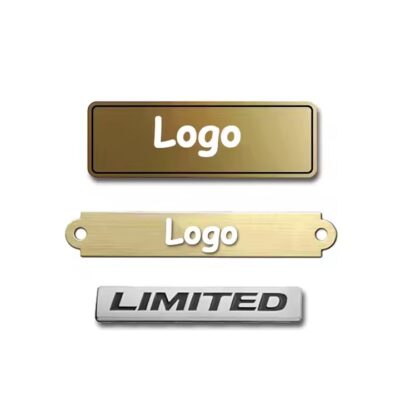 Close-up of a custom 3D engraved metal tag with detailed branding