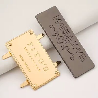 Stylish embossed metal tag with engraved logo for designer handbags