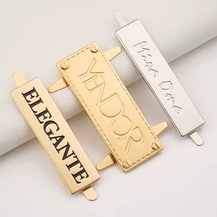 Stylish embossed metal tag with engraved logo for designer handbags