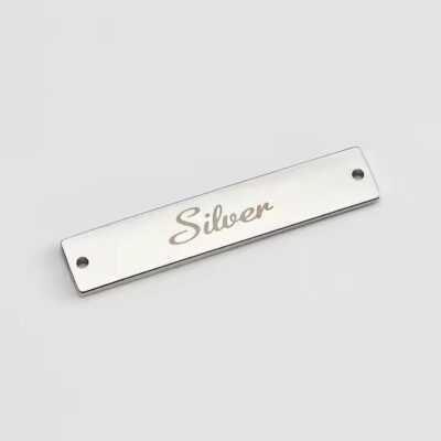 Engraved metal label tag for modern clothing branding