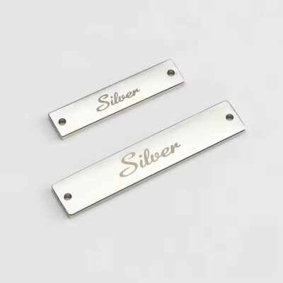 Engraved metal label tag for modern clothing branding