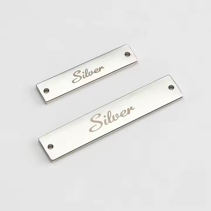 Engraved metal label tag for modern clothing branding