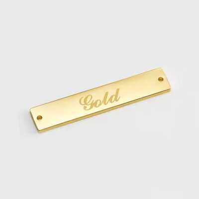 Engraved metal label tag for modern clothing branding