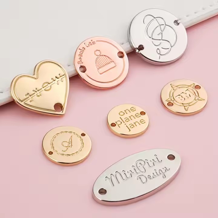 Custom engraved metal tags on swimwear with clear branding and design