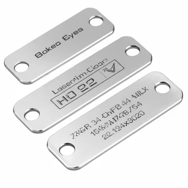 Close-up of a high-precision engraved metal tag with clear, sharp logo details