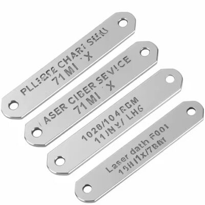 Close-up of a high-precision engraved metal tag with clear, sharp logo details
