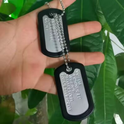 Personalized stainless steel dog tag with etched name and design