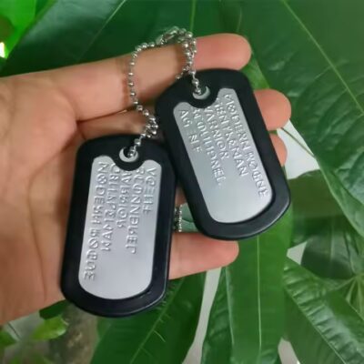 Personalized stainless steel dog tag with etched name and design