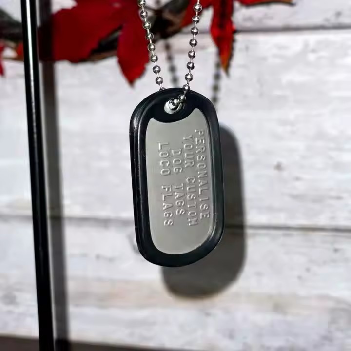 Personalized stainless steel dog tag with etched name and design
