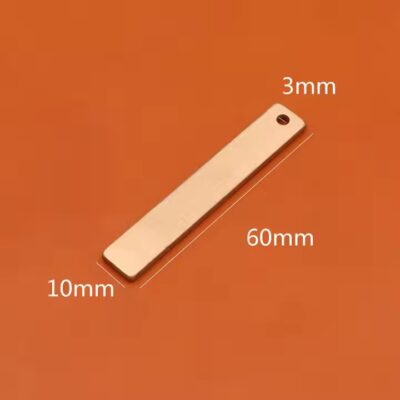Round brass tag with copper label close-up
