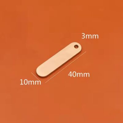 Round brass tag with copper label close-up
