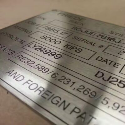 Stainless steel metal tag with pre-drilled holes and printed details