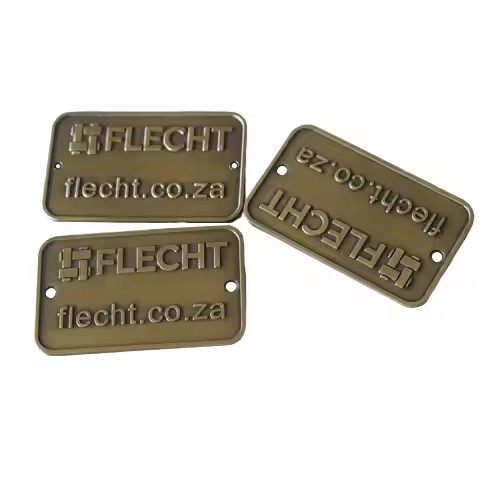 Custom embossed brass furniture logo tag