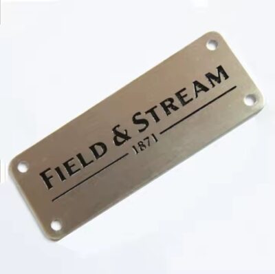Custom metal tags with engraved brand names for fashion accessories