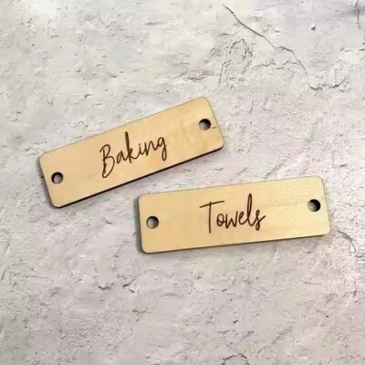 Custom engraved metal tags for branding clothing and apparel items