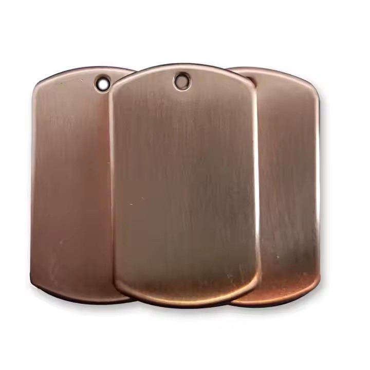 Blank rectangular brass card tag close-up