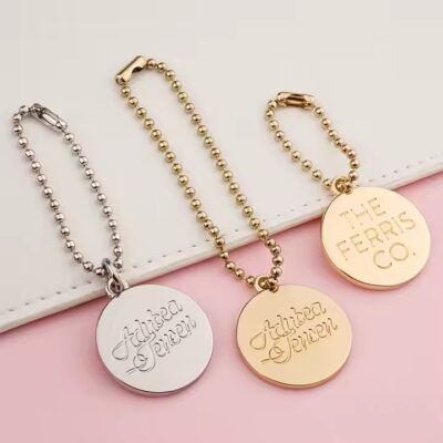 Custom metal bag tag in unique shape with logo