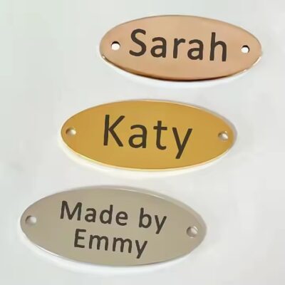 Custom oval metal clothing tag with letters