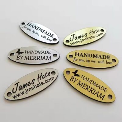 Custom oval metal clothing tag with letters