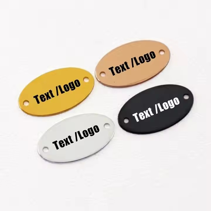 Custom oval metal clothing tag with letters